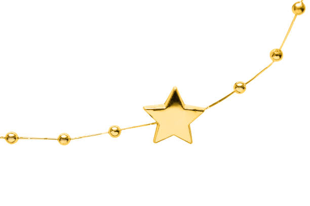 Detail of golden decorative garland closeup on white background