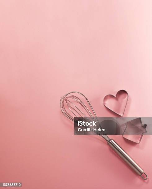Steel Whisk House And Heartshaped Cutter Flat Lay Top View Confectionery Cooking Concept With Copy Space On Bright Pink Paper Background National Cooking Day Stock Photo - Download Image Now