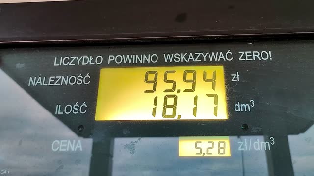The display of a gasoline pump in Poland shows the price (Naleznosc) in PLN and amount (ilosc) of fuel. Gasoline price counter. Display showing gas price and amount of fuel refueled.