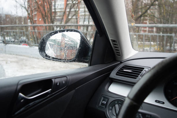 istock View through car window in rainy weather. Rear view window 1373696925