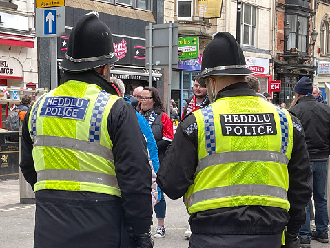 Cardiff, Wales - February 2022: Two police officers on foot patrol in Cardiff city centre