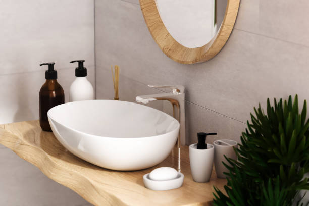 istock White sink standing on a wooden shelf. 1373728064