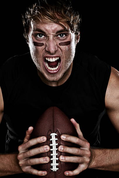 american football player - muscular build action human muscle black and white stock-fotos und bilder