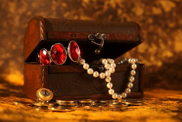 Treasure chest full of jewelry and pearl bracelet