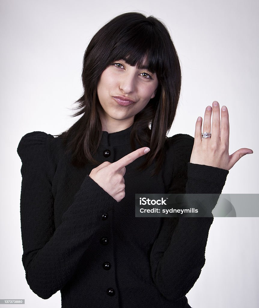 Look at the size of my Ring Young girl with expression on her face pointing at engagement ring Ring - Jewelry Stock Photo