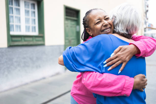 istock Multiracial senior women hugging each other - Elderly diverse community concept - Focus on african female face 1373743525