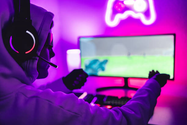 istock Metaverse concept - Gamer boy playing strategy battle video game wearing virtual reality headset - Soft focus on VR goggles 1373743533