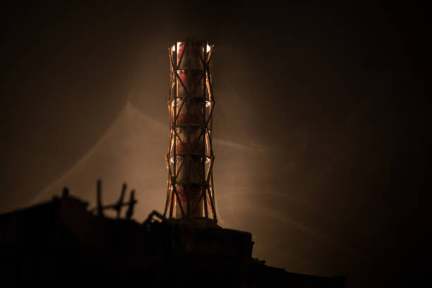 Creative artwork decoration. Chernobyl nuclear power plant at night. Layout of abandoned Chernobyl station after nuclear reactor explosion. Selective focus