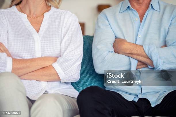 Mature Couple Fighting At Home Sitting On The Sofa Stock Photo - Download Image Now