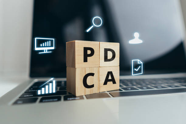 istock Concept PDCA or Plan Do Check Act. Organization of management of processes. Cubes on laptop with icons 1373799703