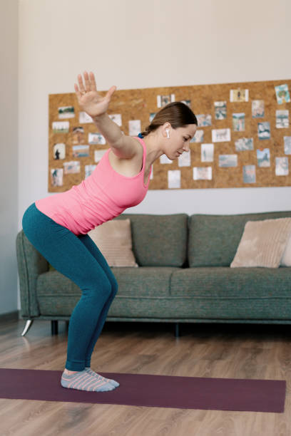 istock Caucasian woman practicing yoga at home 1373805109