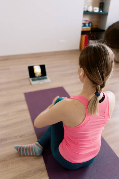 istock Caucasian woman practicing yoga at home 1373805113