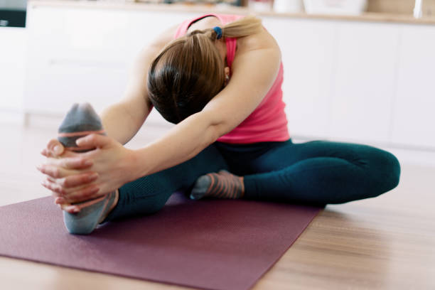 istock Caucasian woman practicing yoga at home 1373805120