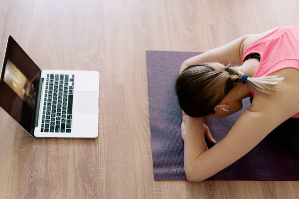 istock Caucasian woman practicing yoga at home 1373805130