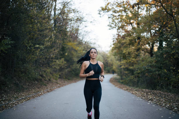 istock young woman exercising in nature 1373807102