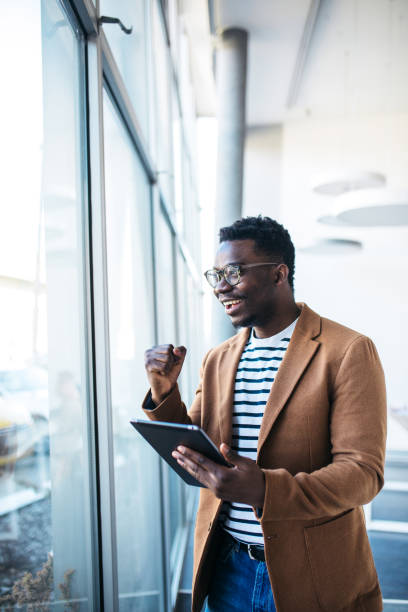 istock Young businessman surfing the net in the modern office 1373837700