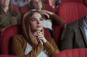 Beautiful women watching movie in cinema