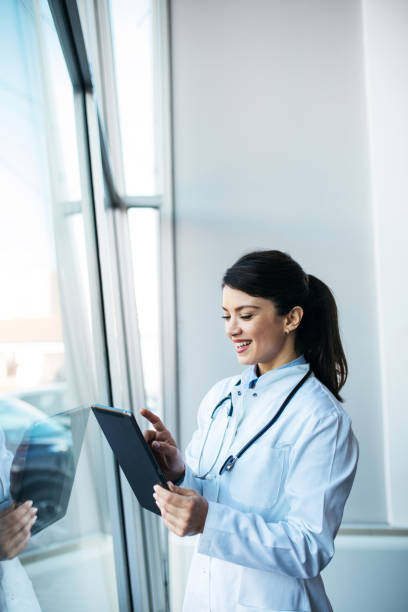 istock Young worried doctor looking at the results 1373843054