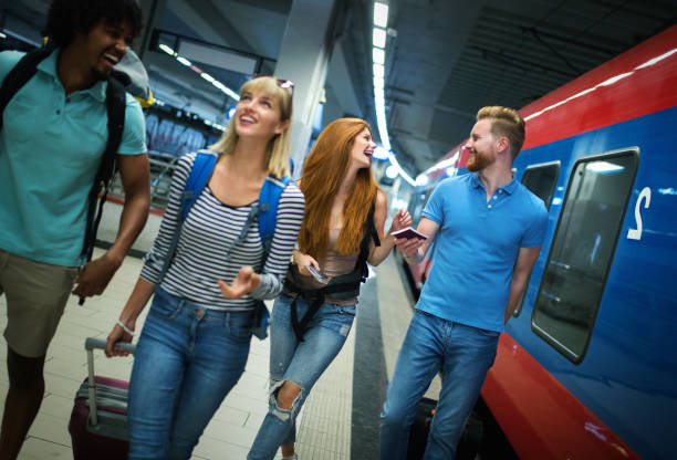 istock Young adults at a train station. 1373843941