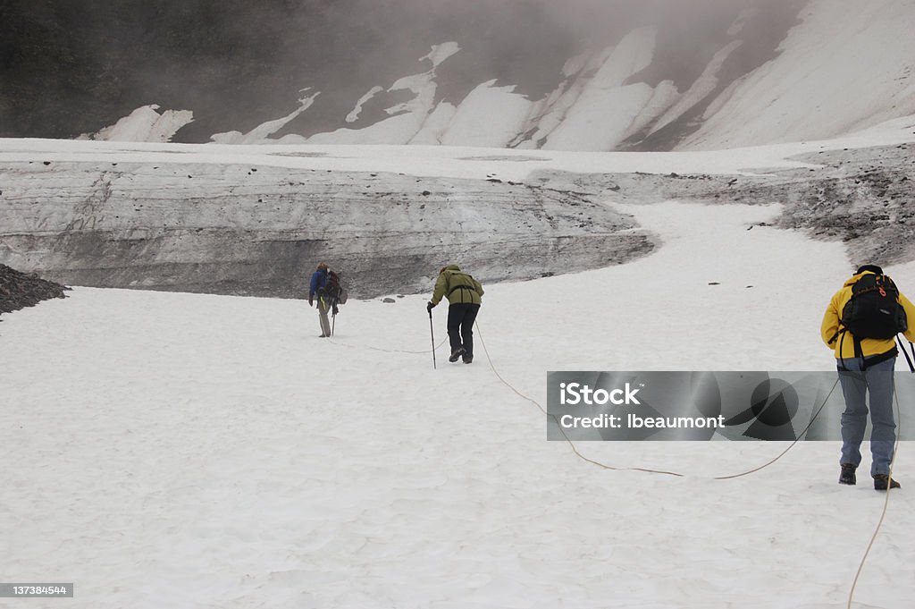 Hiking the Alyeska Glacier Mountaineers climb the Alyeska Glacier in Girdwood Valley, Alaska Adventure Stock Photo