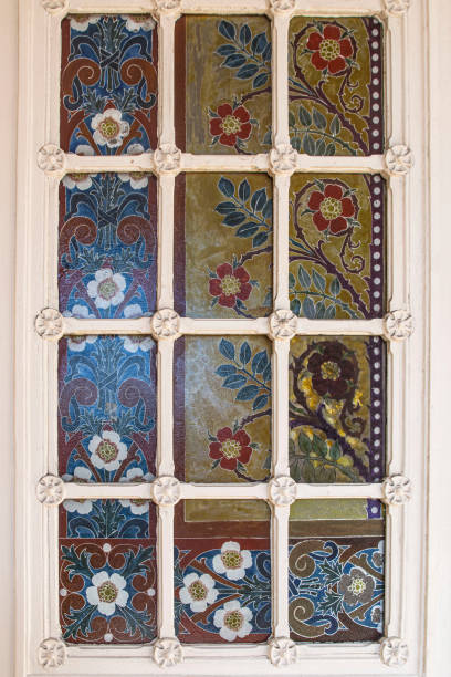 Stained glass window with flowers in a church Close-up of a stained glass window in the church of Saint Eustache in Paris, France église saint eustache stock pictures, royalty-free photos & images