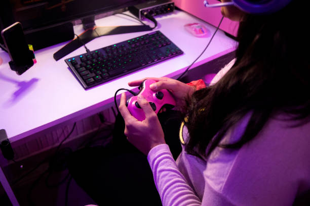 istock Female gamer at home 1373854098