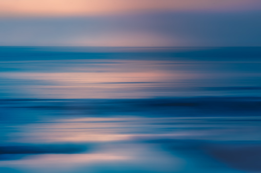 Pink sunset over the sea, abstract seascape. Soft blue and pink colors, fine art, copy space