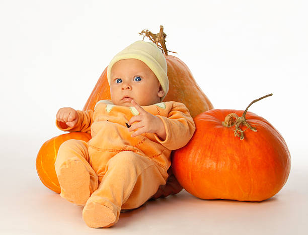 istock Baby with pumpkins 137388332