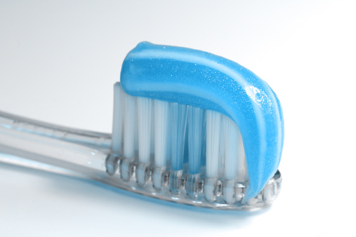 Closeup of a toothbrush with toothpaste