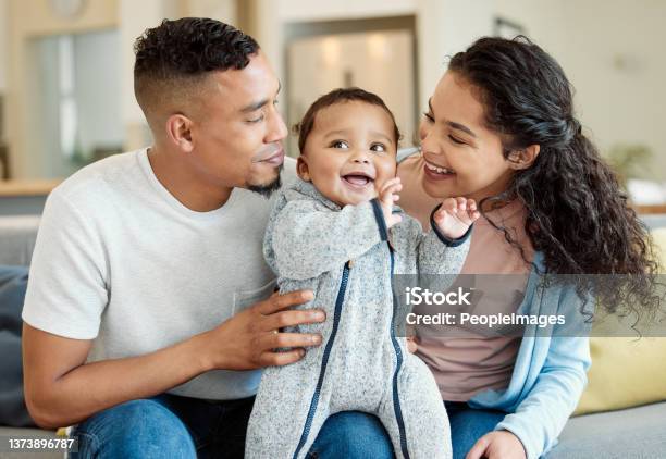 Shot Of A Young Family Bonding With Their Baby Boy At Home Stock Photo - Download Image Now
