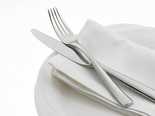 istock Knife fork and napkin on a dinner plate 137390808