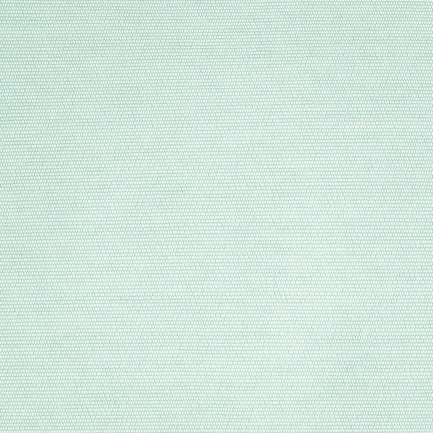 istock Silk fabric wallpaper texture pattern background in light pale green teal color 1373922986