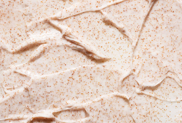 Irregular pattern of creamy organic scrub with brown grains