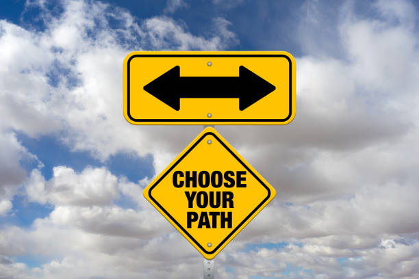 istock Choose Your Path sign with arrows and a cloudscape background 1373960012