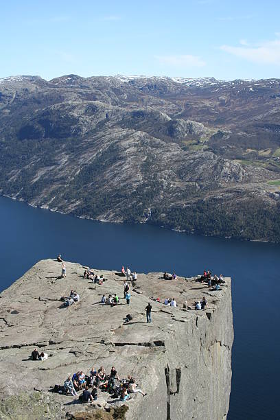 Pulpit rock Pulpit Rock at Lysefjorden in Norway. A well known tourist attraction towering 600 meters over sea level. norway lysefjorden fjord norwegian currency stock pictures, royalty-free photos & images