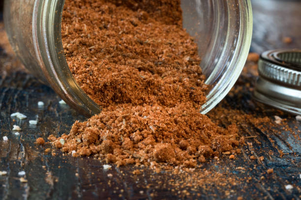 BBQ Rub Spilled from a Jar BBQ Rub Spilled from a Jar rubbing stock pictures, royalty-free photos & images