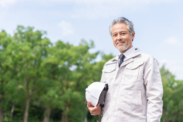 senior asian businessman, construction worker - stockyards industrial park imagens e fotografias de stock