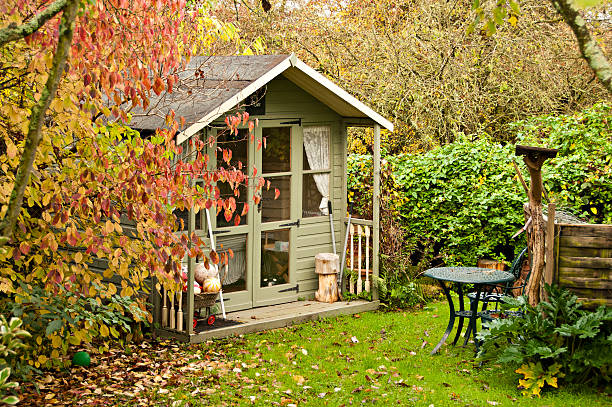 Summerhouse Autumn leaves are  falling in the gardenand and the summerhouse is closed up for another year gazebo photos stock pictures, royalty-free photos & images