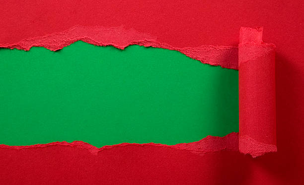 istock Ripped red paper with green background 137420390