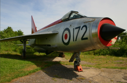 An ex RAF BAC (formerly English Electric) Lightning F-1A XM172 - a supersonic single seater fighter jet fitted with twin Rolls Royce Avon 210R engines. Now retired to an air park looking slightly dilapidated.