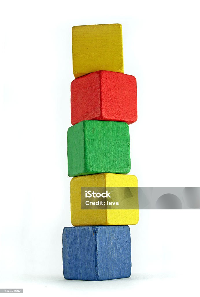 very high tower colorful wooden cilds blocks stacked into a very high tower Block Shape Stock Photo