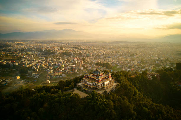 View of Kathmandu capital of Nepal from mountain through urban haze with lot of low rise buildings, cityscape creating an ethereal atmosphere in mountain air, Kathmandu air pollution
