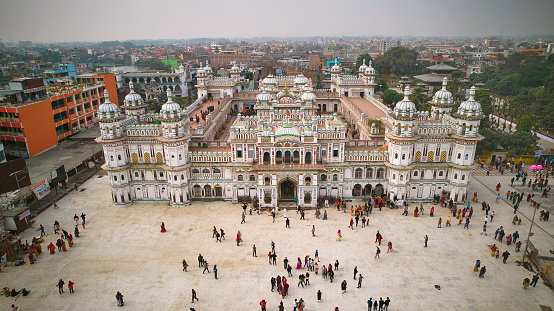 Elevated perspective of plaza filled with tourists visiting architecturally renowned hub for religious and cultural tourism in Madhesh Province.