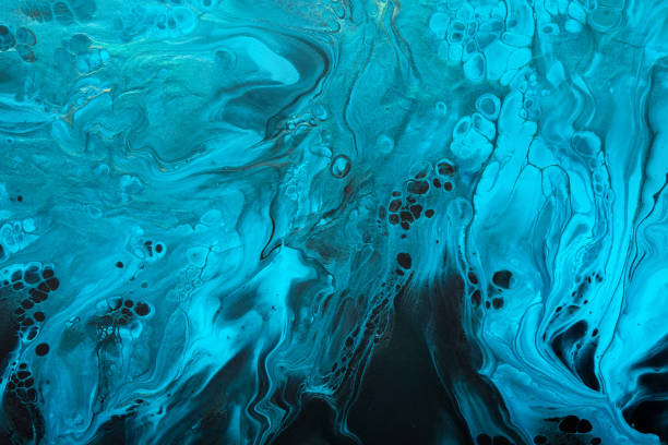 istock Fluid Art. Blue abstract wave swirls on black background. Marble effect background or texture 1374236651