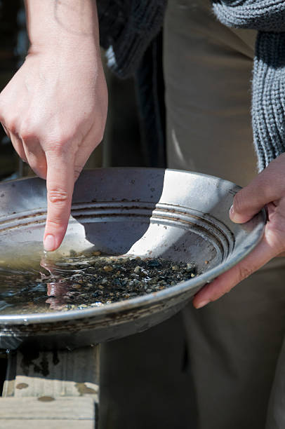 istock woman is panning for gold 137432318