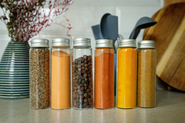 istock Different spices in glass transparent jars for spices on the table in home kitchen with copy space 1374334326