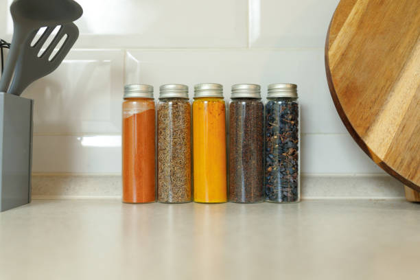 istock Various spices in jars against the wall on a modern kitchen table with copy space 1374334340