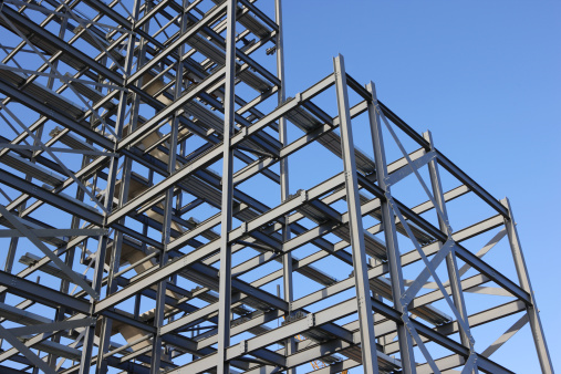 Construction steel framework against blue sky.