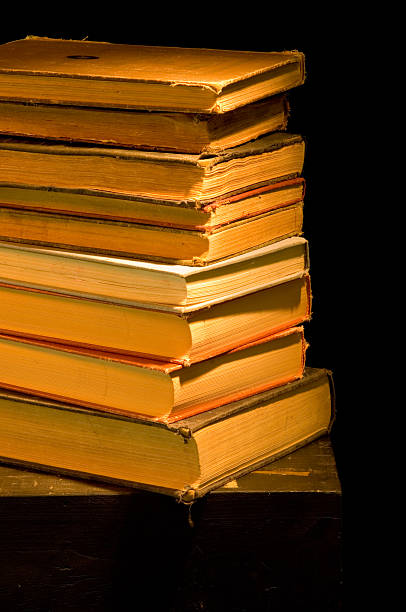 istock Vintage, antique stack of books painted with light 137433901