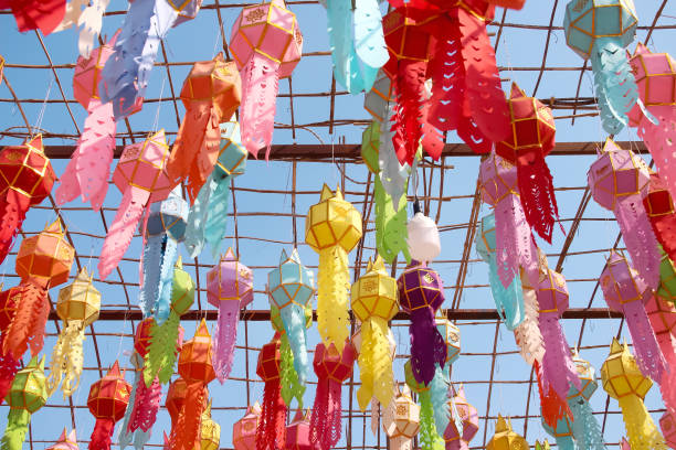 istock Paper lanterns hanging on bamboo wood structure on blue sky background decorative for celebration loy krathong festival in temple , Lumphun of Thailand 1374354778